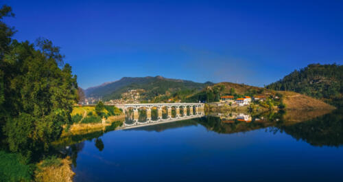 Bridge reflecting in the Cavado river in Rio Caldo, terras de bouro, portugal