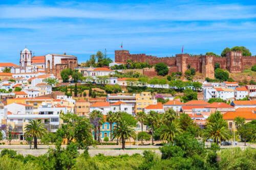 A view of Silves town buildings with famous castle and cathedral, Algarve region, Portugal