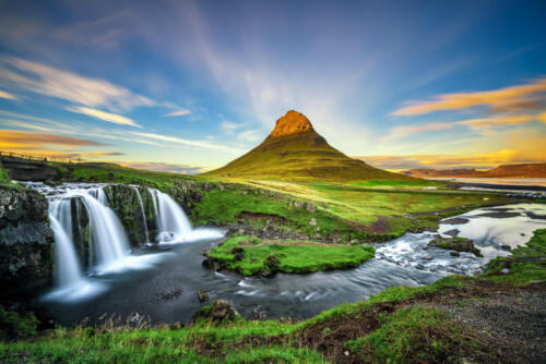 Sunset over Kirkjufellsfoss Waterfall and Kirkjufell mountain in