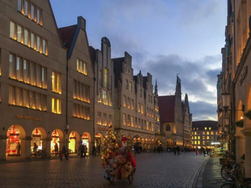 Advent season and Santa Claus on a bike at Prinzipalmarkt in the German city of Muenster