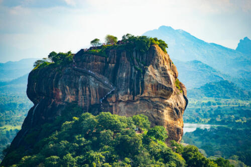 Spectacular view of the Lion rock surrounded by green rich vegetation. Picture taken from Pidurangala Rock in Sigiriya, Sri Lanka.