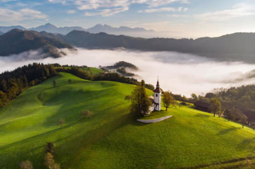 Autumn landscape of a beautiful church on the top of a hill, in Slovenia