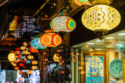 Glass lampshades hanging from the roof of a shop in Fethiye Market, Turkey