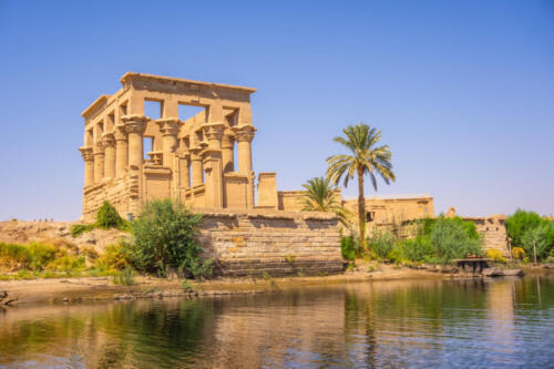 The beautiful temple of Philae and the Greco-Roman buildings seen from the Nile river, a temple dedicated to Isis, goddess of love. Aswan. Egyptian