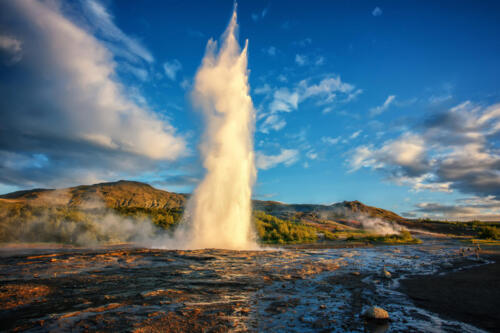 Impressive Eruption of Strokkur Geysir in Iceland during sunset. Strokkur Geyser Is one most popular nature landmark and travel destination Golden circle, Iceland