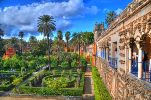 HDR photo of the beautiful amazing gardens in Reales Alcazares in Seville - residence developed from a former Moorish Palace in Andalusia, Spain